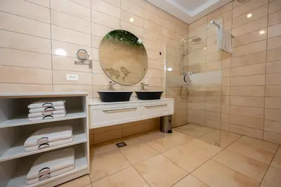 a bathroom with a sink and a shower at Cirus apartments in Kočevje