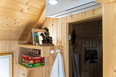 a room with wooden walls and a ceiling with a shelf at Alpine Chalet Velika Planina - Irenca - I Feel Alps in Stahovica