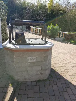 a statue sitting on top of a stone table at Pri Stari murvi in Vogrsko