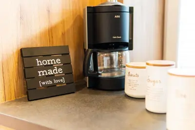 a coffee maker and a box on a counter at Zelena dolina in Cerkno
