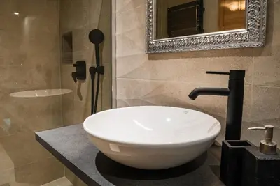 a bathroom with a white sink and a mirror at Zelena dolina in Cerkno