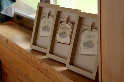 a row of threeangularangular signs on a wooden shelf at Wooden fairytale in Lesično
