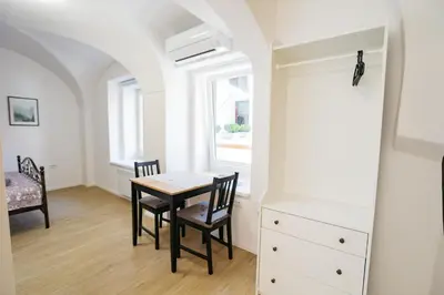 a dining room with a table and chairs at 150 steps to the main square in Ljubljana