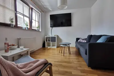 a living room with a couch and a table at My House in Bovec