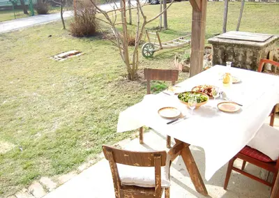 a white table with a plate of food on it at Balajceva domačija - Moravske Toplice in Moravske Toplice