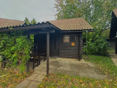 a small cabin with a table and a roof at Teddy in Čatež ob Savi