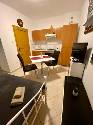 a kitchen and dining room with a table and chairs at Jack's Place in Trbovlje