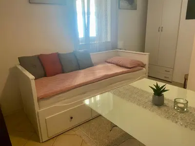 a couch sitting on a table in a room at Jack's Place in Trbovlje