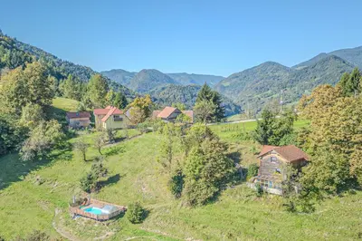 an aerial view of a house on a hill with mountains at Pool & Wellness Chalet Sunshine - Happy Rentals in Vransko