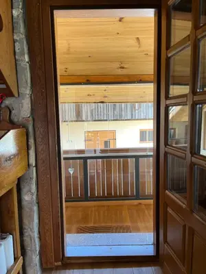 an open door with a view of a balcony at Domačija Brdar in Adlešiči