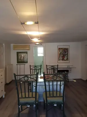 a dining room with three chairs and a table at Above Ljubljanica River Apartment in Ljubljana