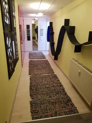a hallway with a rug on the floor at Above Ljubljanica River Apartment in Ljubljana