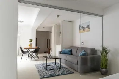 a living room with a couch and a table at Zabjak5 in Ljubljana