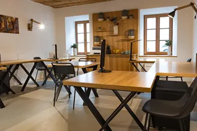 a dining room with wooden tables and chairs at Zabjak5 in Ljubljana