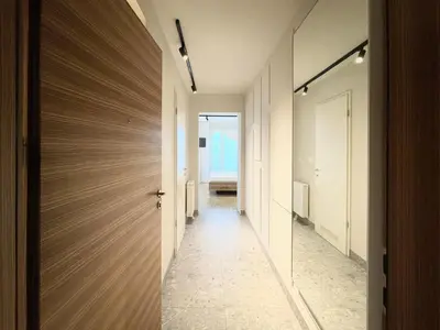 a hallway of a house with a door at Studio XII in Bled