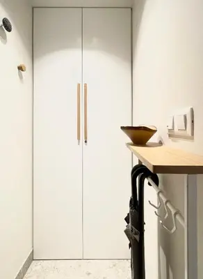 a kitchen with white cabinets and a counter at Studio XII in Bled