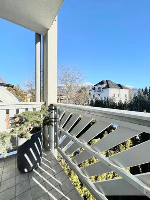 a balcony with a white fence and a bench at Studio XII in Bled