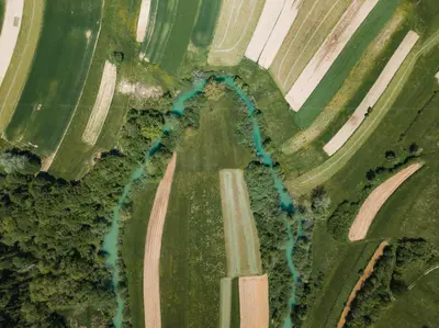 an aerial view of a road and a river at Kmečka hiša Bahor in Črnomelj