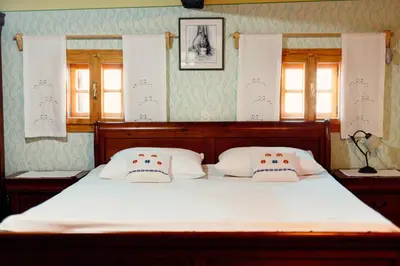 a bedroom with a bed with two pillows on it at Kmečka hiša Bahor in Črnomelj