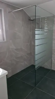 a shower with a glass door in a bathroom at Gostišče pri Rudiju in Šalovci