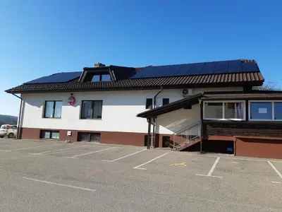 a building with solar panels on top of it at Gostišče pri Rudiju in Šalovci