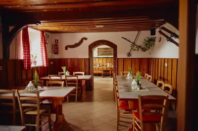 a dining room with wooden tables and chairs at Pr` Florjan in Cerklje na Gorenjskem