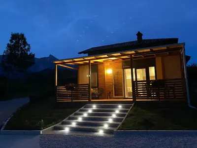 a house with a pathway leading to it at night at Hiša Uran in Kobarid
