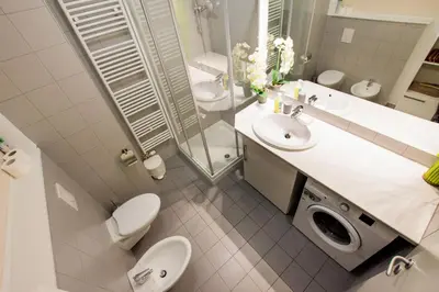 a bathroom with a toilet sink and a shower at Apartma Svit in Kranjska Gora