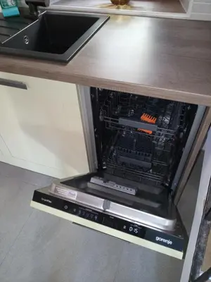 an oven with its door open in a kitchen at Hiša pod Gradičem in Kobarid