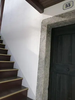 a stairway leading to a door with a number next to it at Hiša pod Gradičem in Kobarid