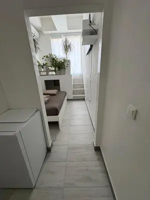 a hallway with a couch in a room at INDUSTRIAL STUDIO 1 in Ljubljana