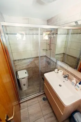 a bathroom with a sink and a shower at Zidanica Bahor in Črnomelj