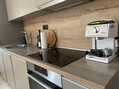a kitchen with a sink and a counter top at Villa Sanela in Pobegi