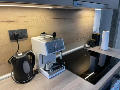 a coffee machine on a counter in a kitchen at Villa Sanela in Pobegi