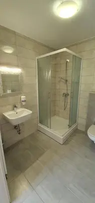 a bathroom with a shower and a sink at Gostilna s prenočišči Pri Janezu in Zgornja Ložnica