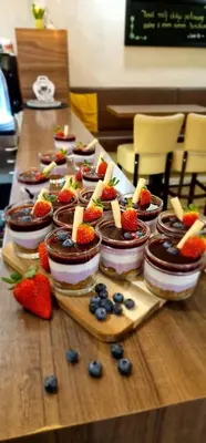 a table with desserts and fruit on top of it at Gostilna s prenočišči Pri Janezu in Zgornja Ložnica