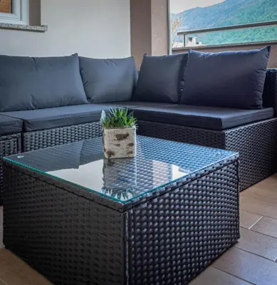 a living room with a couch and a table at Hiša Bohinc z wellnessom in Tolmin