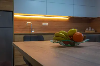 a bowl of fruit sitting on top of a table at Hiša Bohinc z wellnessom in Tolmin