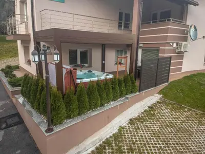 a house with a swimming pool in the yard at Hiša Bohinc z wellnessom in Tolmin