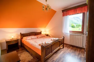 a bedroom with a bed and a window at Holiday apartment Pika in Bovec