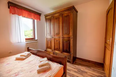 a bedroom with a bed with two towels on it at Holiday apartment Pika in Bovec