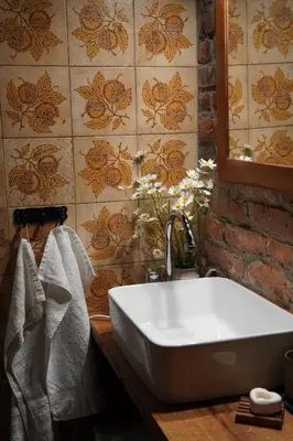 a bathroom with a white tub and a tile wall at HIS-a za 2 in Dragatuš
