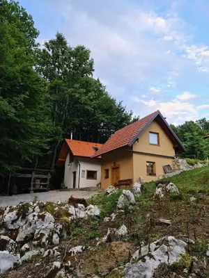 a house with an orange roof on top of a hill at Zidanica Žagar in Dolenjske Toplice