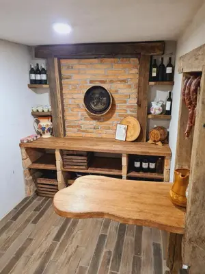 a room with a bench in front of a brick wall at Zidanica Žagar in Dolenjske Toplice