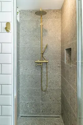 a bathroom with a shower with a glass door at Hiša Lojz in Žaga