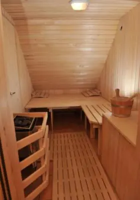 a small room with a table and benches in a small room at Turistična kmetija Kunstek in Rogatec