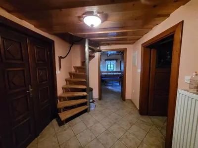 a hallway with a staircase in a house at Turistična kmetija Kunstek in Rogatec