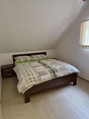 a bedroom with a bed in a attic at Apartma Ribnica na Pohorju in Ribnica na Pohorju