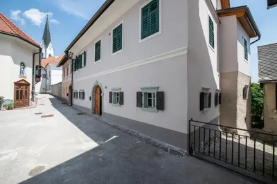 a street in a town with a church at MEŽNARIJA Radovljica in Radovljica