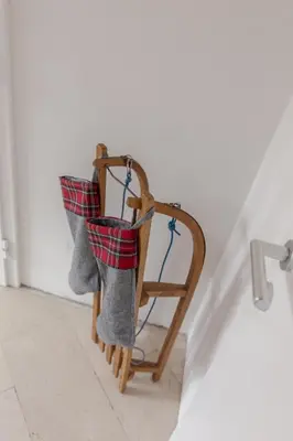 a pair of christmas stockings hanging on a wall at Apartments Smreka Kranjska Gora in Kranjska Gora